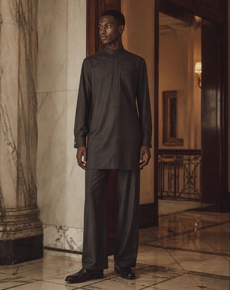 A charcoal long kaftan and matching trouser photographed in a marble hotel lobby